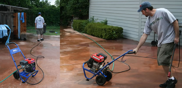 Brook Roberts uses power sprayer to clean off pool deck
