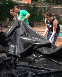 Pulling pool tarp free